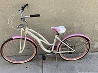 Side profile view of Schwinn Lulu women's cruiser bike showing frame, tires, fenders, and seat.