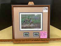 Framed Julian Friers signed art print showing mallards, with two serial numbered Habitat Conservation stamps and framed in wood-tone frame