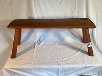 Front and side view of the solid oak Craftsman style bench showing the structure and leg design.