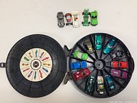 Open Hot Wheels Rally Case with ten cars inside and four cars positioned above the case