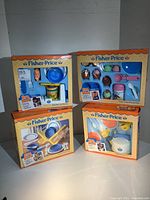 Four original boxed Fisher-Price Fun With Food toy sets including Pop-Top Can Opener, Party Time Dessert Set, Whistling Tea Kettle Set, Family Dinnerware