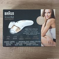 Front of retail box showing Braun branding, product image, contents list, and promotional text