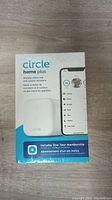 Front of box showing Circle Home Plus device, branding, and membership offer.