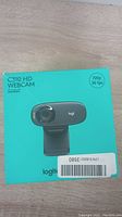 Logitech C310 HD webcam box showing key specifications of 720p resolution at 30fps