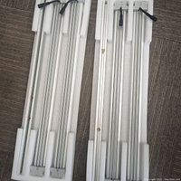 Two aluminum LED bars in foam packaging