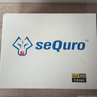 White box packaging with Sequro logo and Full HD 7.0 inch text.