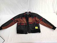 Full front view of men's brown and black leather jacket with knitted pattern lying flat on white surface