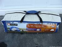 Ozark Trail tent in its carry bag showing brand and size label