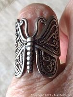 Front view of vintage sterling silver butterfly ring with openwork wings showing detailed filigree patterns and butterfly body