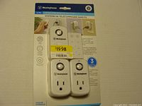Packaged Westinghouse 3-piece wireless remote system, including one remote and two receiver plugs, shown front-facing with pricing sticker.