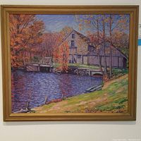 Framed painting of barn and creek in autumn with colorful trees and water reflections, signed by Robert Williams.