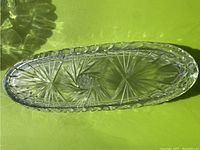 Top view of the oval crystal bowl showing the starburst pinwheel pattern inside.