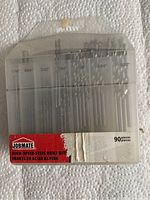 Photo of clear plastic case containing 90 Jobmate high-speed steel drill bits with visible size markings.