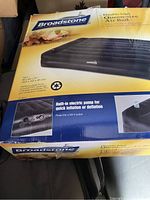 Box showing Broadstone Queen Size Air Bed with double thickness and built-in electric pump for inflation and deflation. Includes bed dimensions and product image.