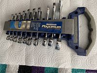 Front view of the Mastercraft Maximum stubby combination wrench set displaying all 11 wrenches held on a plastic organizer with handle.