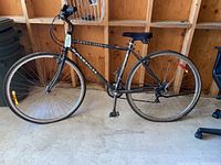 Full side view of Raleigh Cross Lite bike showing the entire bike with 18 inch frame, gel seat, and kickstand.
