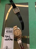 Both watches and handwritten lot tag visible