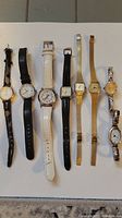 Full overview of all 8 ladies watches showing variations in band types, colors, and face shapes.