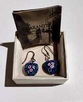Pair of vintage Murano Millefiori floral glass earrings with sterling silver 925 hooks in a jewelry box, including a guarantee certificate.