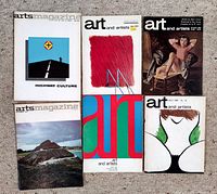 Photo of six vintage art magazines from the 'Art and Artists' and 'Arts Magazine' series laid out on a carpeted floor. Various cover images and designs visible, showing the magazines' condition and variety.