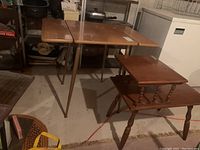 Photo showing the Mid-Century Modern drop leaf table with two 8x24 inch leaf extensions and hairpin metal legs, and wooden side table with two tiers, spindle supports and turned legs.