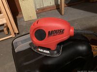 Photo of Black & Decker Mouse palm sander on carrying case showing sander details and cord