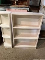 Photo of both white wooden shelves side by side showing overall shape and size.