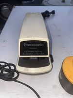 Front view of Panasonic electric stapler showing model and brand details