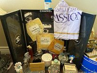 Partial view of Chanel display board with assorted perfume bottles in front