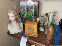 Lot overview showing bust, perfume stand, atomizers, box and vase