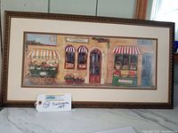 Full view of framed boulangerie bakery art print on marble surface with auction lot tag in front