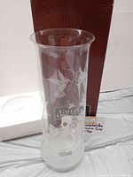 Photo showing clear etched glass hurricane lamp with hummingbird and flower motifs, accompanied by original brown box and white foam insert.