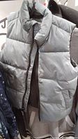 Grey sleeveless puffer vest by Old Navy shown on hanger
