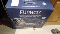 Box of Fun Boy Houndstooth Winter Sleigh inflatable snow sled showing packaging and branding.