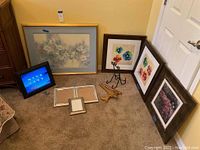 Overview of all wall decor items and accessories including prints, digital frame, empty frames, and figurine.
