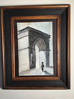 Full view of the framed original artwork, showing the architectural scene and the small figure in front of a large archway.