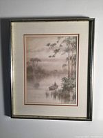 Full view of framed watercolor painting in gold colored frame with triple mats