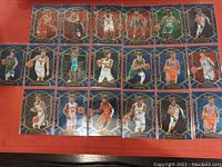 A set of twenty basketball rookie cards from the Select series displayed in four rows on a flat surface. Each card features a different player in full color with blue and gold design borders.