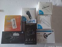 Photo showing 5 wireless headsets and earphones in their retail packaging including Labkabe TWS True Wireless Earphones, multiple Link Dream Bluetooth headsets, and RSP-06 headset.