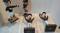 Four Rockies baseball bobbleheads including two Todd Helton, one Matt Holliday in King Soopers 2008 promotion packaging, and one Charlie Blackmon without box