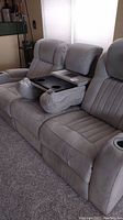 Front view of three-seat grey micro-suede electric reclining sofa