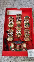 Top view of the carousel display with 6 carousel horses and decorated base, including wiring and original instruction paper.
