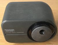 Front view of Panasonic electric pencil sharpener showing brand, model, and sharpening hole.
