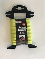 Photo showing new paracord wound on black plastic holder with label indicating size 1/8 inch by 25 feet, brand Tool Bench.