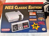 Original box front showing NES Classic Edition console and controller images, highlighting 30 built-in classic games like Super Mario Bros. and Metroid