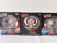 Three Pennywise Dorbz figures in original boxes showing front design and packaging