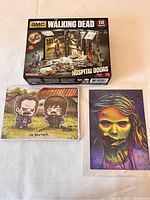 AMC The Walking Dead Hospital Doors 112-piece maquette set box, cartoon print of Daryl and Merle, and zombie artwork print