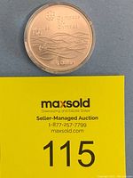 Obverse side of silver coin showing 1976 Montreal Olympics swimming design, inscribed with event title and denomination.