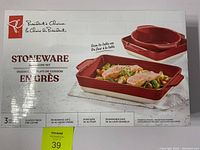 Box front showing President's Choice 3 piece stoneware bakeware set with red glazed finish and image of baked food.
