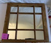 Front view of the antique wooden window frame mirror showing all 9 mirror panes and wood frame.